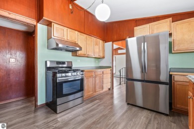 Located just within the city limits, this home offers character on Traverse City Golf and Country Club in Michigan - for sale on GolfHomes.com, golf home, golf lot