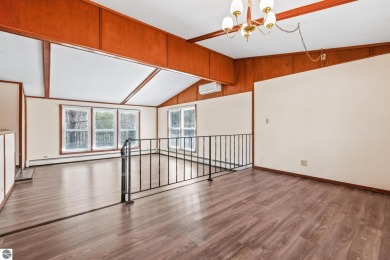 Located just within the city limits, this home offers character on Traverse City Golf and Country Club in Michigan - for sale on GolfHomes.com, golf home, golf lot