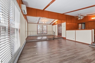 Located just within the city limits, this home offers character on Traverse City Golf and Country Club in Michigan - for sale on GolfHomes.com, golf home, golf lot