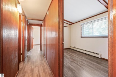 Located just within the city limits, this home offers character on Traverse City Golf and Country Club in Michigan - for sale on GolfHomes.com, golf home, golf lot