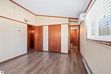 Located just within the city limits, this home offers character on Traverse City Golf and Country Club in Michigan - for sale on GolfHomes.com, golf home, golf lot