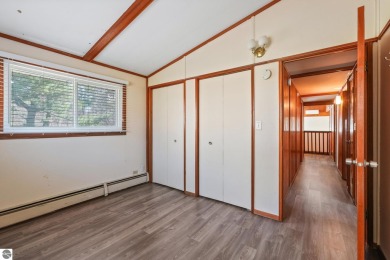 Located just within the city limits, this home offers character on Traverse City Golf and Country Club in Michigan - for sale on GolfHomes.com, golf home, golf lot