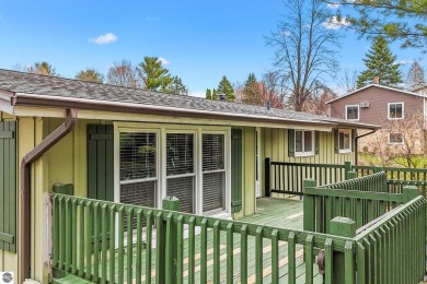 Located just within the city limits, this home offers character on Traverse City Golf and Country Club in Michigan - for sale on GolfHomes.com, golf home, golf lot