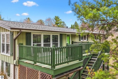 Located just within the city limits, this home offers character on Traverse City Golf and Country Club in Michigan - for sale on GolfHomes.com, golf home, golf lot