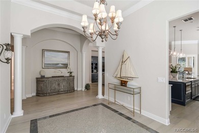 THIS GORGEOUS CUSTOM HOME welcomes you with an intricately on Skyview At Terra Vista Golf and Country Club in Florida - for sale on GolfHomes.com, golf home, golf lot