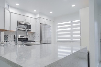 Step into this beautifully renovated, move-in ready first floor on Wynmoor Golf Course in Florida - for sale on GolfHomes.com, golf home, golf lot