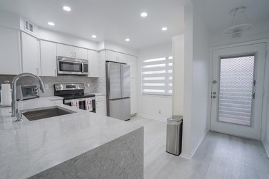 Step into this beautifully renovated, move-in ready first floor on Wynmoor Golf Course in Florida - for sale on GolfHomes.com, golf home, golf lot