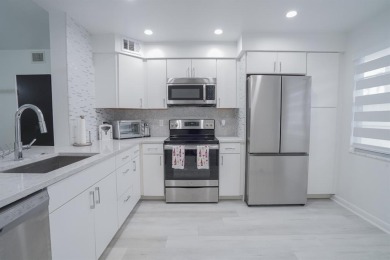 Step into this beautifully renovated, move-in ready first floor on Wynmoor Golf Course in Florida - for sale on GolfHomes.com, golf home, golf lot