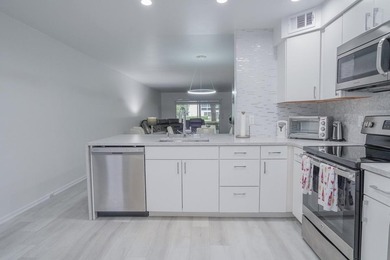 Step into this beautifully renovated, move-in ready first floor on Wynmoor Golf Course in Florida - for sale on GolfHomes.com, golf home, golf lot