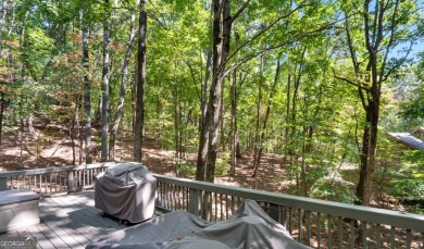 This is a light and bright, fully renovated, real log cabin in on Big Canoe Golf Club - Cherokee in Georgia - for sale on GolfHomes.com, golf home, golf lot