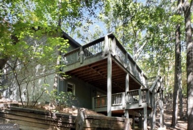 This is a light and bright, fully renovated, real log cabin in on Big Canoe Golf Club - Cherokee in Georgia - for sale on GolfHomes.com, golf home, golf lot