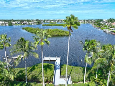 This stunning waterfront British West Indies-style home offers 5 on Jonathans Landing Golf Club in Florida - for sale on GolfHomes.com, golf home, golf lot