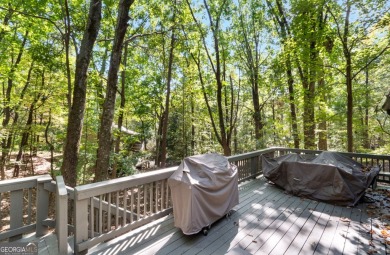 This is a light and bright, fully renovated, real log cabin in on Big Canoe Golf Club - Cherokee in Georgia - for sale on GolfHomes.com, golf home, golf lot