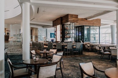 This stunning waterfront British West Indies-style home offers 5 on Jonathans Landing Golf Club in Florida - for sale on GolfHomes.com, golf home, golf lot