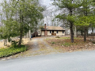 Escape to the Poconos in this beautifully updated 3-bedroom on Pocono Farms Country Club in Pennsylvania - for sale on GolfHomes.com, golf home, golf lot