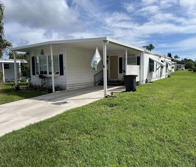 Welcome to 15 La Costa Lane, a charming 2-bedroom, 2-bath on Spanish Lakes Golf Village in Florida - for sale on GolfHomes.com, golf home, golf lot