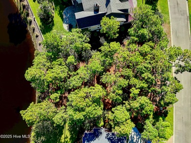 Discover a rare opportunity to own one of the few remaining pond on Members Club At St. James Plantation in North Carolina - for sale on GolfHomes.com, golf home, golf lot