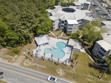 Welcome to this charming first-floor condo, ideally positioned on Carolina Shores Golf Course in North Carolina - for sale on GolfHomes.com, golf home, golf lot