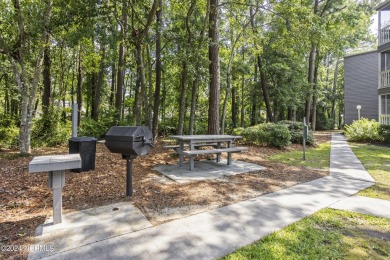 Welcome to this charming first-floor condo, ideally positioned on Carolina Shores Golf Course in North Carolina - for sale on GolfHomes.com, golf home, golf lot