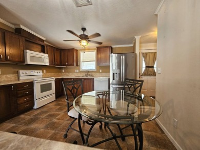 Located in a 55+ resort-style manufactured home community on on Big Cypress Golf and Country Club in Florida - for sale on GolfHomes.com, golf home, golf lot