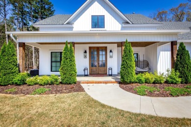 Welcome to your dream lakehouse featuring a boat slip. Enjoy on  in Arkansas - for sale on GolfHomes.com, golf home, golf lot