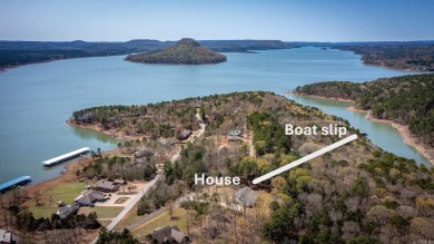Welcome to your dream lakehouse featuring a boat slip. Enjoy on  in Arkansas - for sale on GolfHomes.com, golf home, golf lot