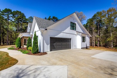 Welcome to your dream lakehouse featuring a boat slip. Enjoy on  in Arkansas - for sale on GolfHomes.com, golf home, golf lot