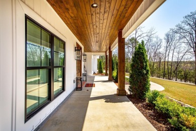 Welcome to your dream lakehouse featuring a boat slip. Enjoy on  in Arkansas - for sale on GolfHomes.com, golf home, golf lot