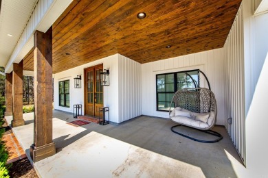 Welcome to your dream lakehouse featuring a boat slip. Enjoy on  in Arkansas - for sale on GolfHomes.com, golf home, golf lot