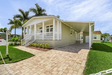 This 2024 Jacobsen Home offering two bedrooms, plus a den, is on Royal Wood Golf and Country Club in Florida - for sale on GolfHomes.com, golf home, golf lot