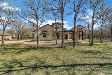 This exquisite modern Spanish-style custom home located in a on Sugar Tree Golf and Country Club in Texas - for sale on GolfHomes.com, golf home, golf lot