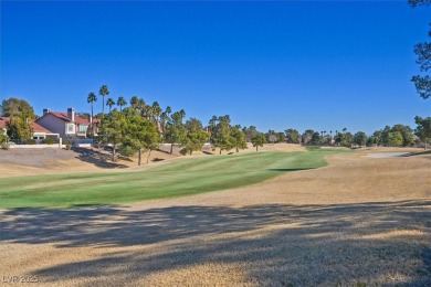 This stunning designer home, nestled on a scenic golf course on Spanish Trail Golf and Country Club in Nevada - for sale on GolfHomes.com, golf home, golf lot