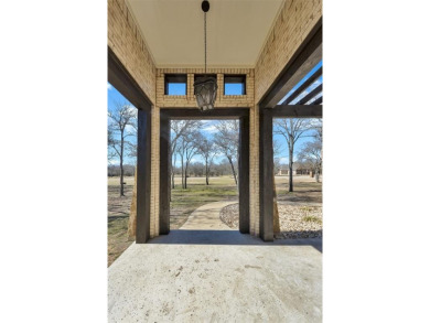 This exquisite modern Spanish-style custom home located in a on Sugar Tree Golf and Country Club in Texas - for sale on GolfHomes.com, golf home, golf lot