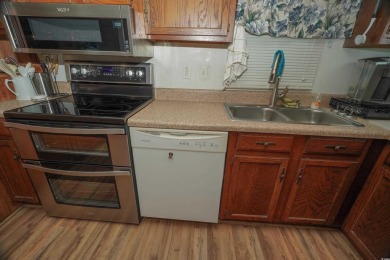Discover tranquility in this fully furnished 3-bedroom, 2-bath on Prestwick Country Club in South Carolina - for sale on GolfHomes.com, golf home, golf lot