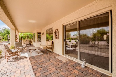 Beautiful landscaping greets you into this popular Palmera model on Oakwood Golf Club  in Arizona - for sale on GolfHomes.com, golf home, golf lot