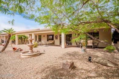 Beautiful landscaping greets you into this popular Palmera model on Oakwood Golf Club  in Arizona - for sale on GolfHomes.com, golf home, golf lot