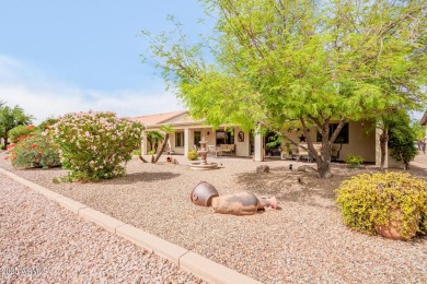 Beautiful landscaping greets you into this popular Palmera model on Oakwood Golf Club  in Arizona - for sale on GolfHomes.com, golf home, golf lot