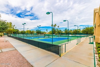 Beautiful landscaping greets you into this popular Palmera model on Oakwood Golf Club  in Arizona - for sale on GolfHomes.com, golf home, golf lot