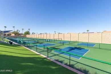 Beautiful landscaping greets you into this popular Palmera model on Oakwood Golf Club  in Arizona - for sale on GolfHomes.com, golf home, golf lot