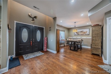 Spacious and stylish 2-story home in Horseshoe Bend on over 1 on Seasons Ridge At Four Seasons in Missouri - for sale on GolfHomes.com, golf home, golf lot