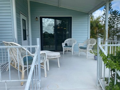 Enjoy the Florida lifestyle in this furnished mobile home in on Spanish Lakes Fairways in Florida - for sale on GolfHomes.com, golf home, golf lot