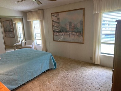 Enjoy the Florida lifestyle in this furnished mobile home in on Spanish Lakes Fairways in Florida - for sale on GolfHomes.com, golf home, golf lot