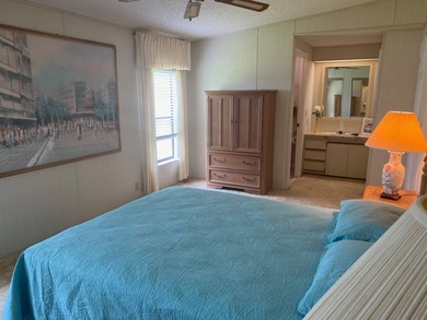 Enjoy the Florida lifestyle in this furnished mobile home in on Spanish Lakes Fairways in Florida - for sale on GolfHomes.com, golf home, golf lot