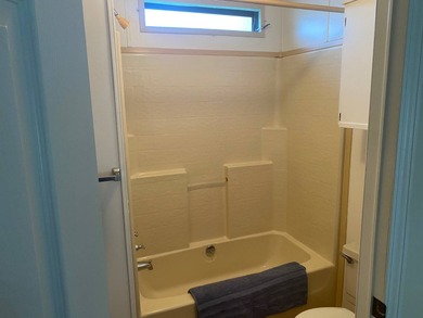 Enjoy the Florida lifestyle in this furnished mobile home in on Spanish Lakes Fairways in Florida - for sale on GolfHomes.com, golf home, golf lot