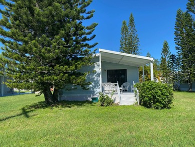 Enjoy the Florida lifestyle in this furnished mobile home in on Spanish Lakes Fairways in Florida - for sale on GolfHomes.com, golf home, golf lot