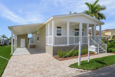 This 2024 Jacobsen Home offering two bedrooms, two bath, is on Royal Wood Golf and Country Club in Florida - for sale on GolfHomes.com, golf home, golf lot