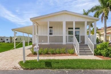 This 2024 Jacobsen Home offering two bedrooms, two bath, is on Royal Wood Golf and Country Club in Florida - for sale on GolfHomes.com, golf home, golf lot