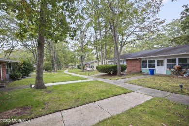 Step into this beautifully remodeled 2-bedroom, 1-bath condo in on Greenbriar Woodlands in New Jersey - for sale on GolfHomes.com, golf home, golf lot