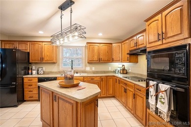 Welcome to this stunning, well maintained custom-built home on Bayview Golf Course in Missouri - for sale on GolfHomes.com, golf home, golf lot