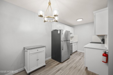 Step into this beautifully remodeled 2-bedroom, 1-bath condo in on Greenbriar Woodlands in New Jersey - for sale on GolfHomes.com, golf home, golf lot